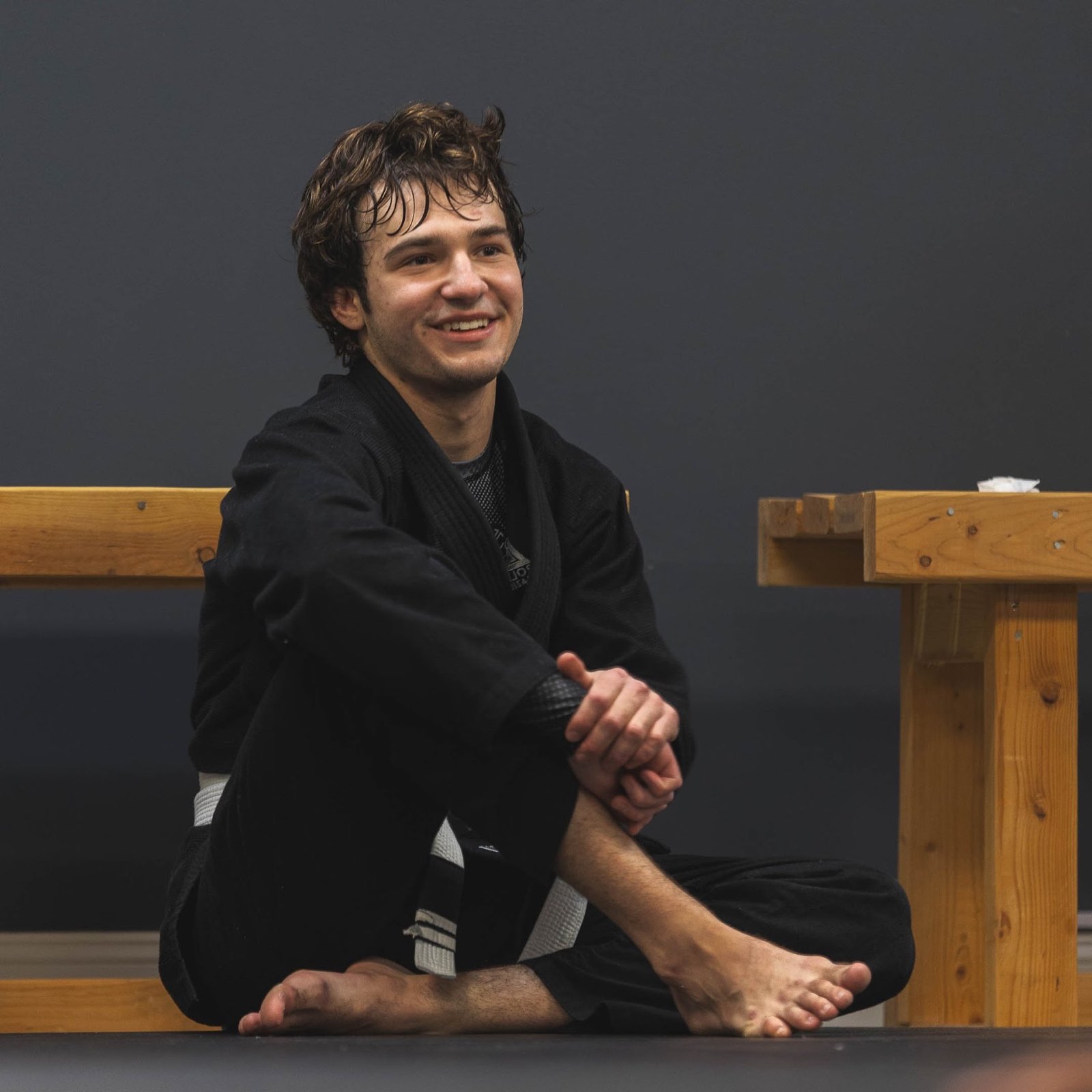 An adult Brazilian Jiu-Jitsu student smiling after training at Rolling Bear BJJ in Kenilworth, New Jersey