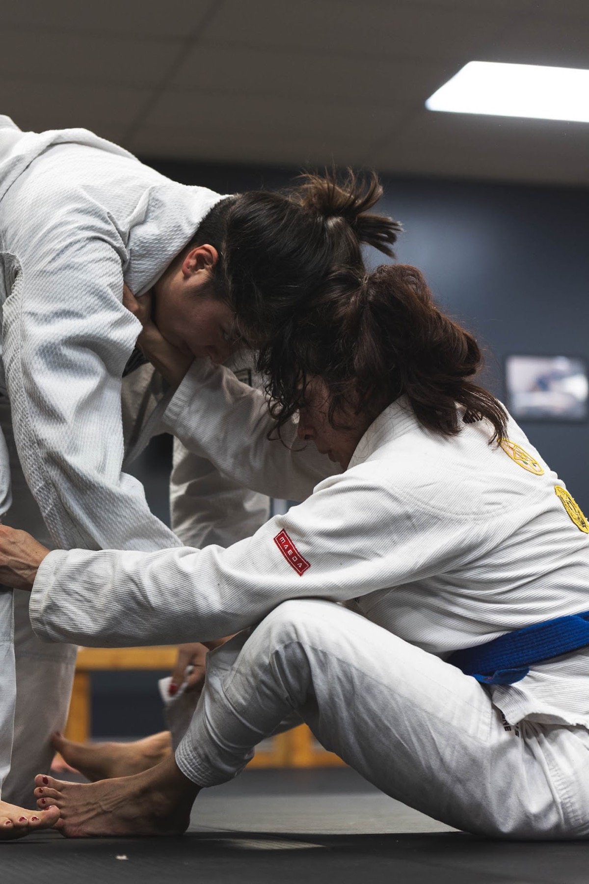Adult students practicing Gi Brazilian Jiu-Jitsu together at Rolling Bear BJJ in Kenilworth, New Jersey
