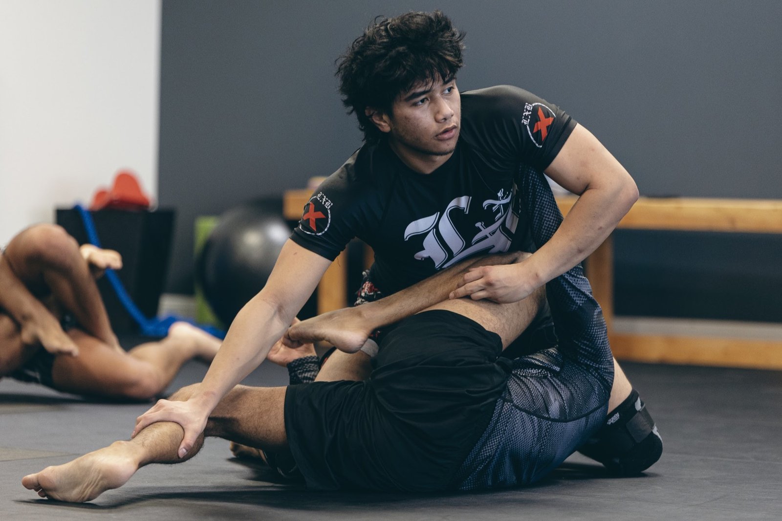 Adult students training No-Gi Brazilian Jiu-Jitsu technique at Rolling Bear BJJ
