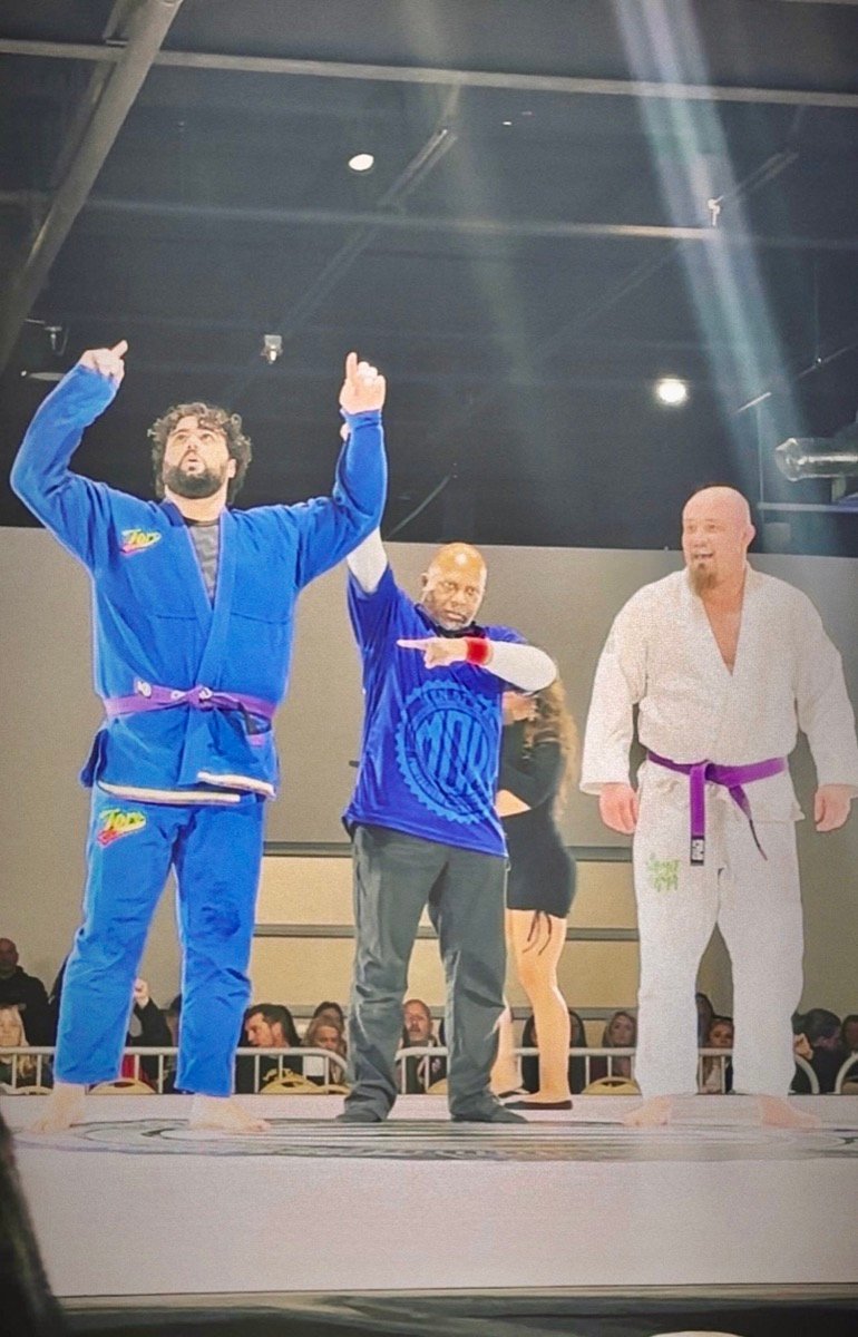 Coach Leo Bergamasco celebrating a Brazilian Jiu-Jitsu competition victory